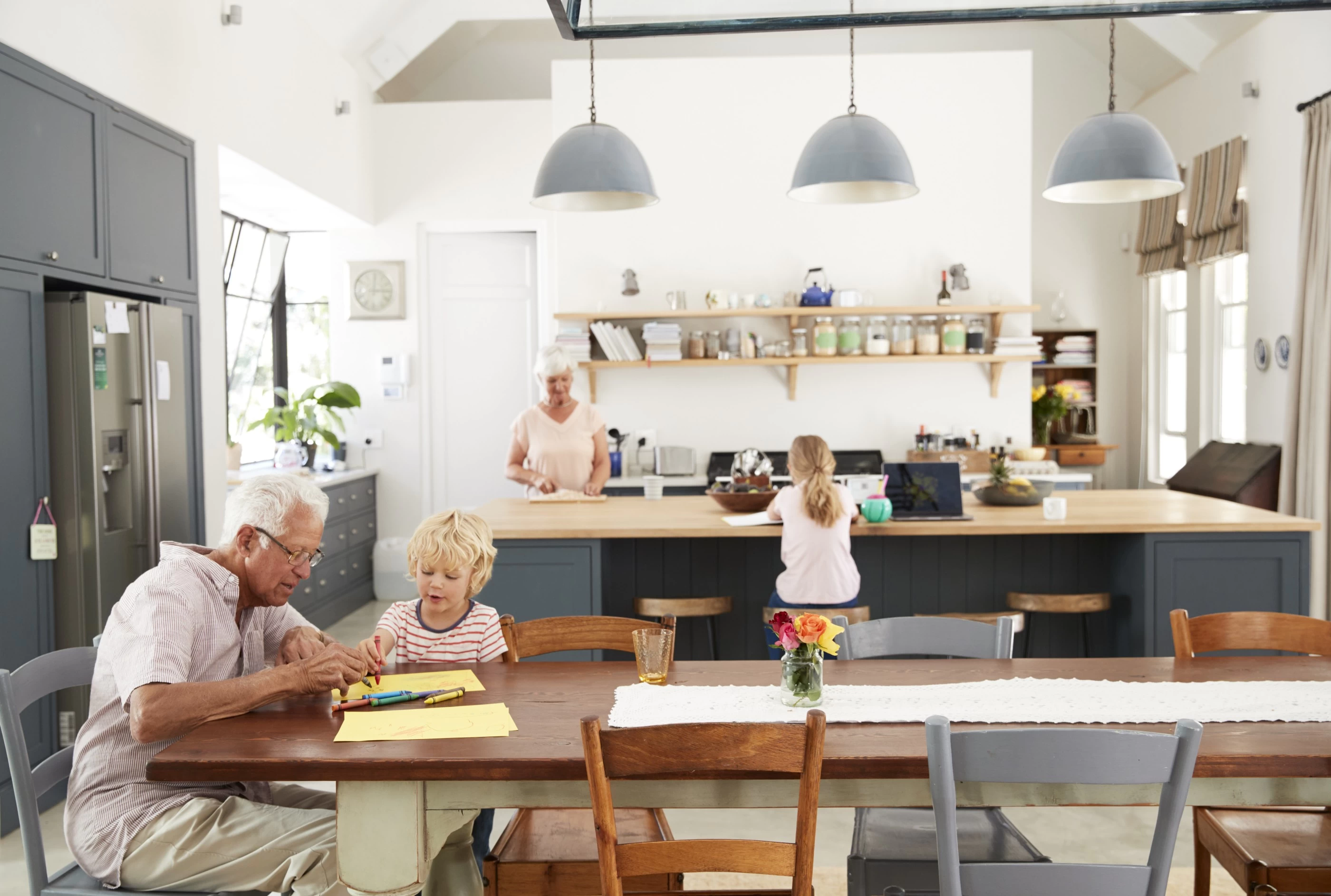 Grandparents in an energy efficient kitchen 