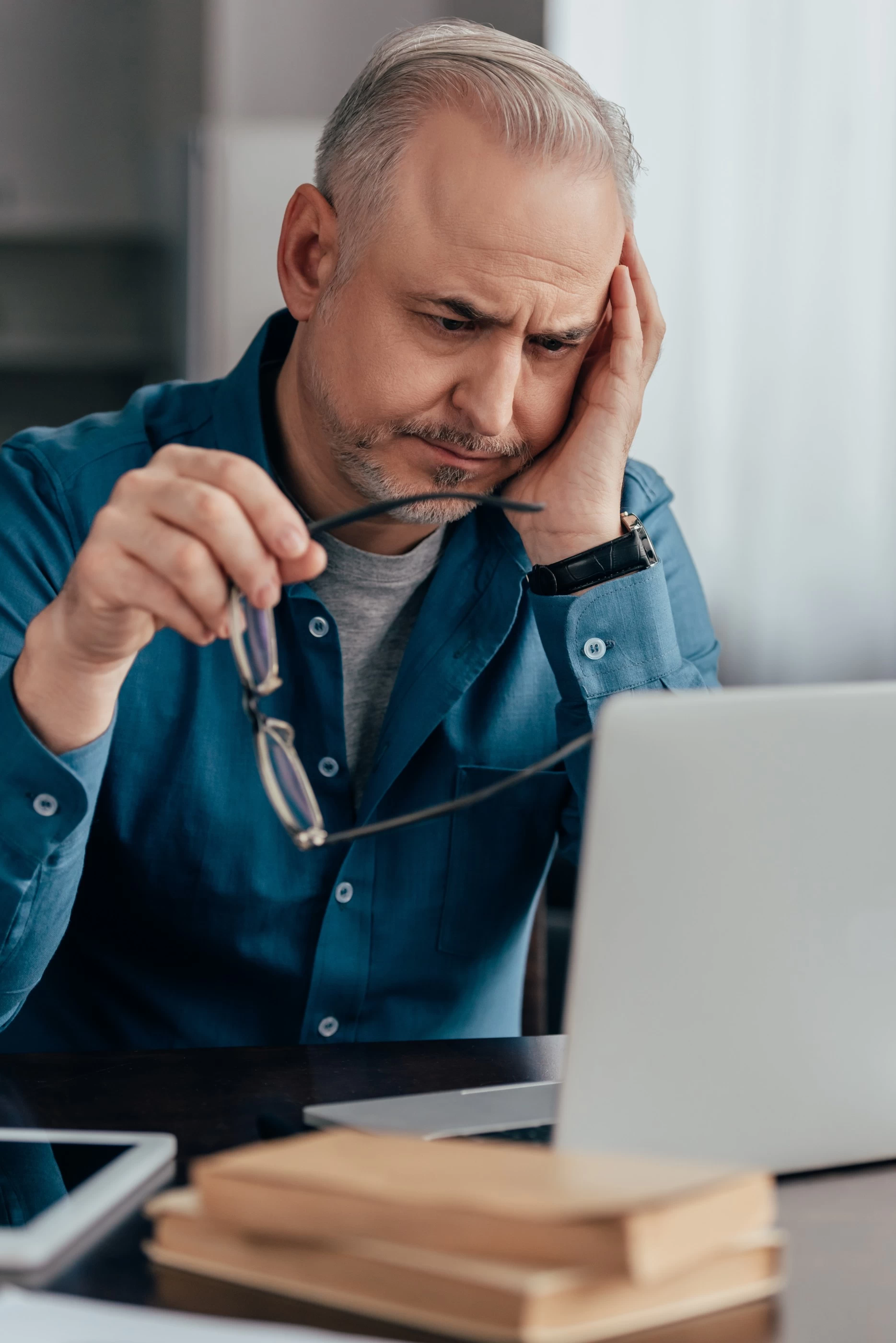 Man reading law that requires him to have an EICR for rented property